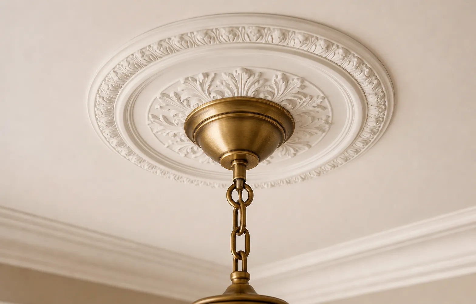 Illustrative close detail of an enclosed brass chandelier canopy aligned against a finished ceiling medallion